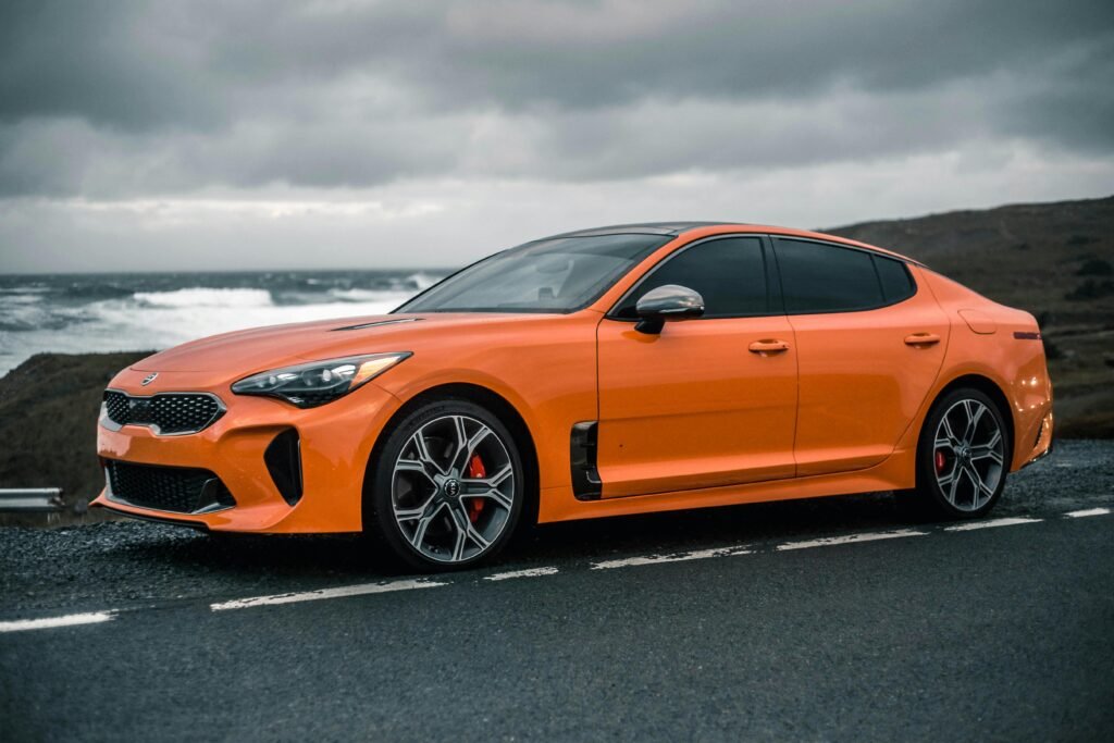 orange car under clack clouds