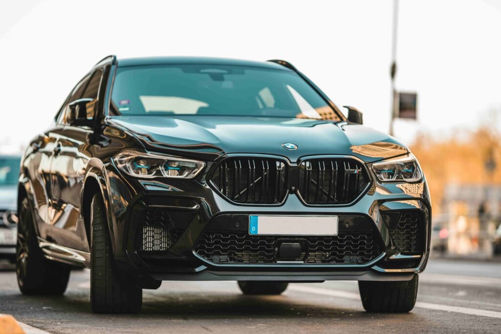 black elegant BMW X5 is standing on the road